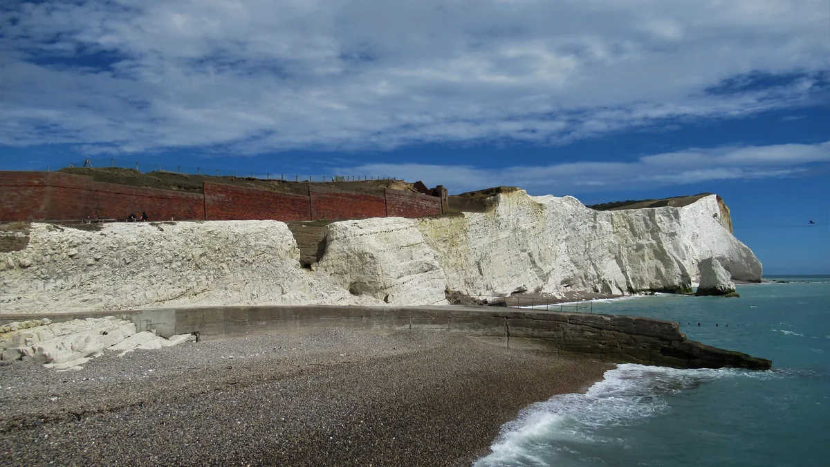 The beach and chalk cliffs below Seaford Head